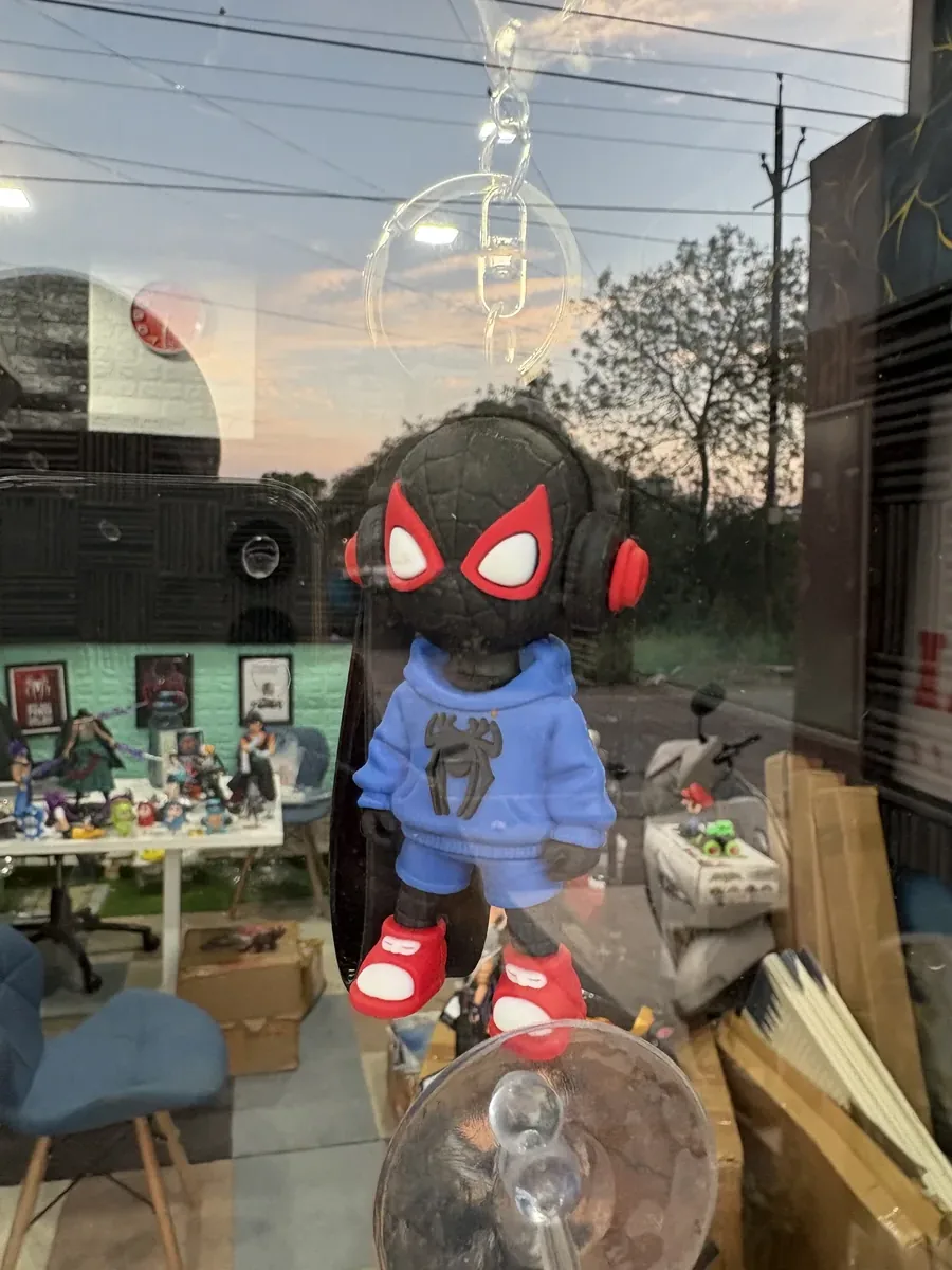 Black spiderman with blue jacket key chain